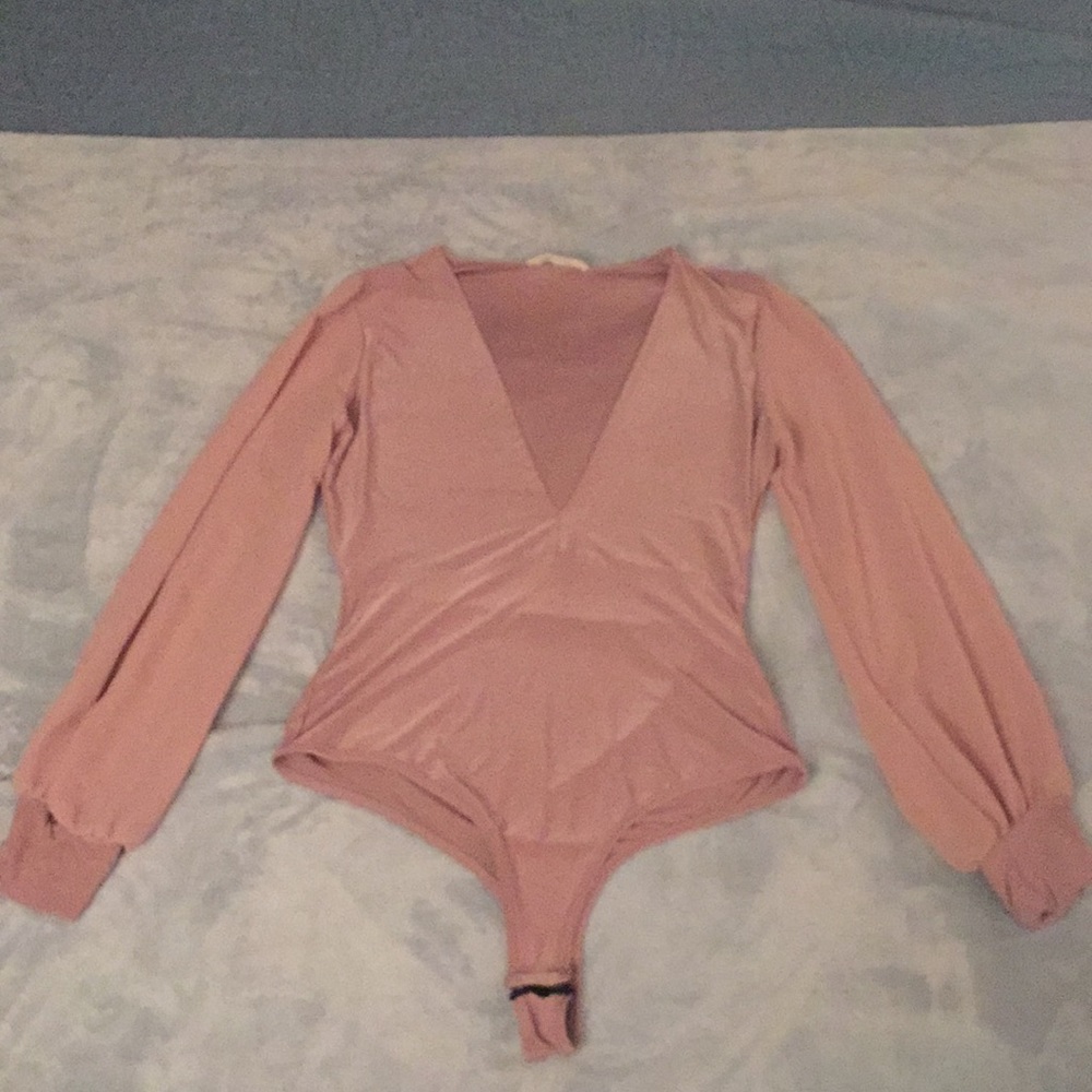 Long sleeve dress shirt. Low cut neck